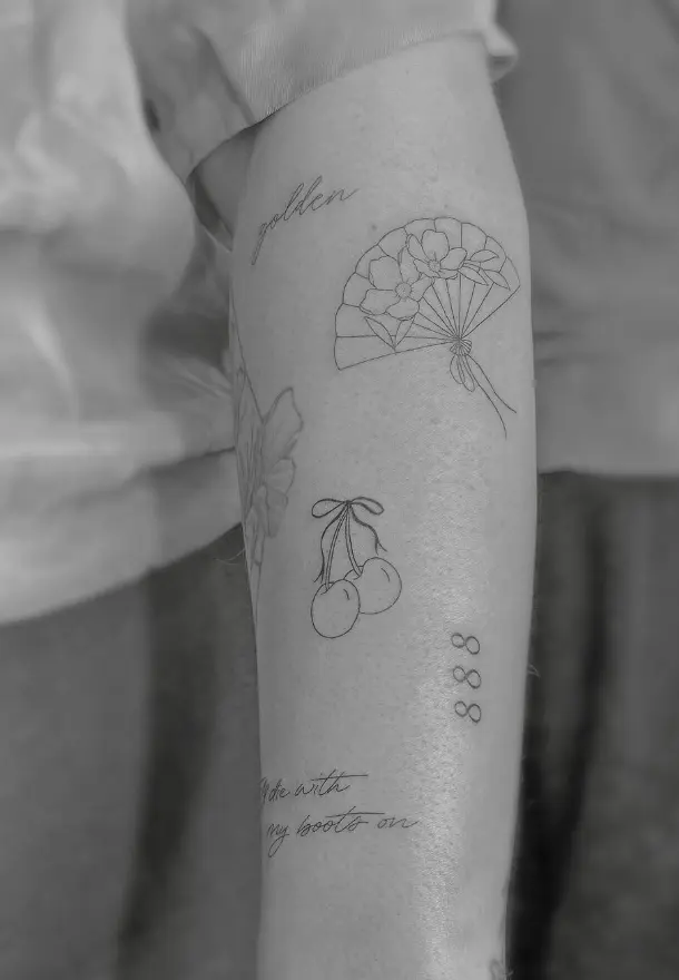 Fan, cherry and text tattoo collection with fine line work by Chelsea.Q